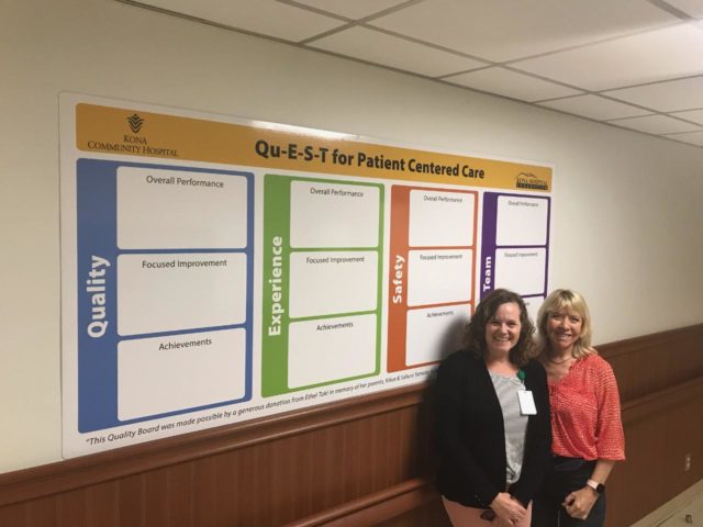 Heidi Fromm, RN Department Head and Donna Hiranaka, Chair Kona Hospital Foundation in front of Quality Board